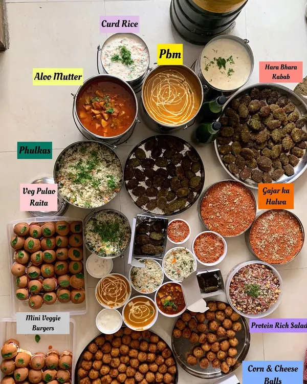 This is what pure joy looks like. A complete homemade vegetarian feast I prepared for a birthday party of over 100 guests, featuring everything from starters like Hara Bhara Kebabs and Corn Cheese Balls to main courses like Aloo Mutter and Paneer Butter Masala, complete with fresh Phulkas, Veg Pulao, and Gajar ka Halwa for dessert.