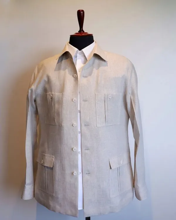 Made from high-quality linen, the cream-white hue of this overshirt adds a touch of understated luxury to any ensemble.