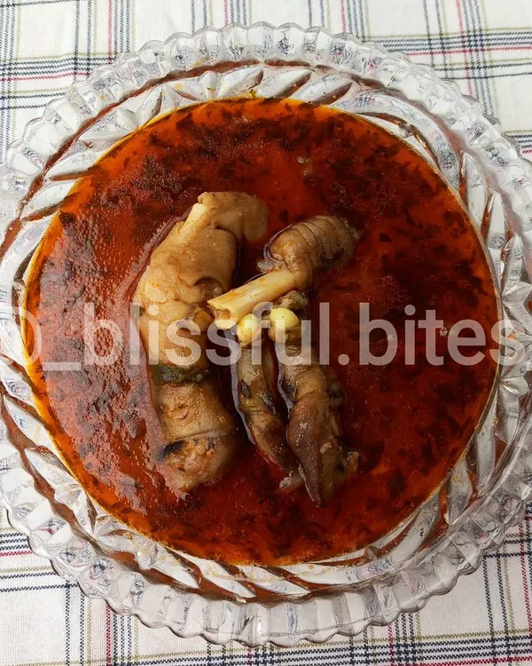 A bowl of my traditional Mutton Paya, or lamb trotters curry. This dish is slow-cooked to perfection, resulting in a rich, flavourful, and gelatinous broth.