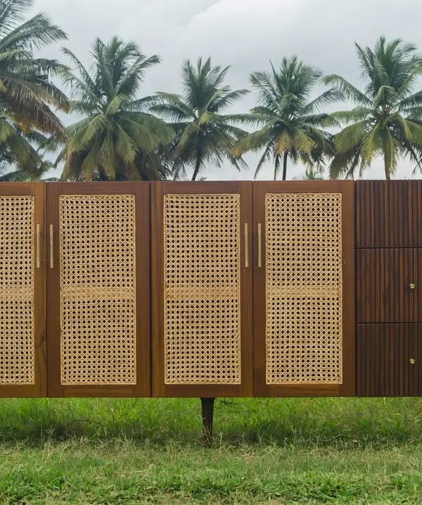 Part of the Ballygunge Console Series, this bespoke unit was designed for a home in Kolkata. It combines closed rattan-paneled cabinets with open shelving and fluted wooden drawers, offering a variety of storage options.