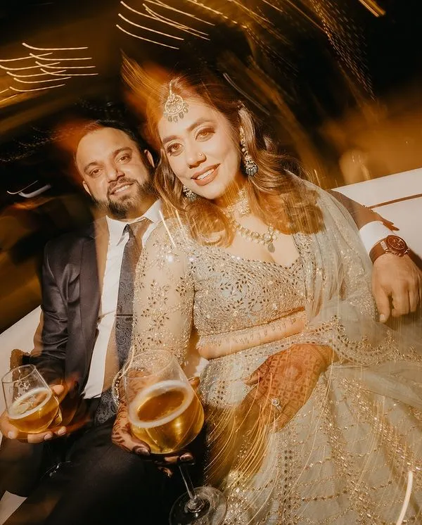 A stunning portrait of the couple at their cocktail party, captured with a creative light trail effect. This shot is full of energy, glamour, and a touch of magic.