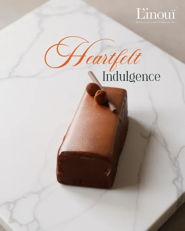Our Belgian Truffle Cake, available as an elegant single-serve pastry. It’s the perfect portion of heartfelt indulgence, featuring layers of milk and dark chocolate with a silky Swiss glaze.