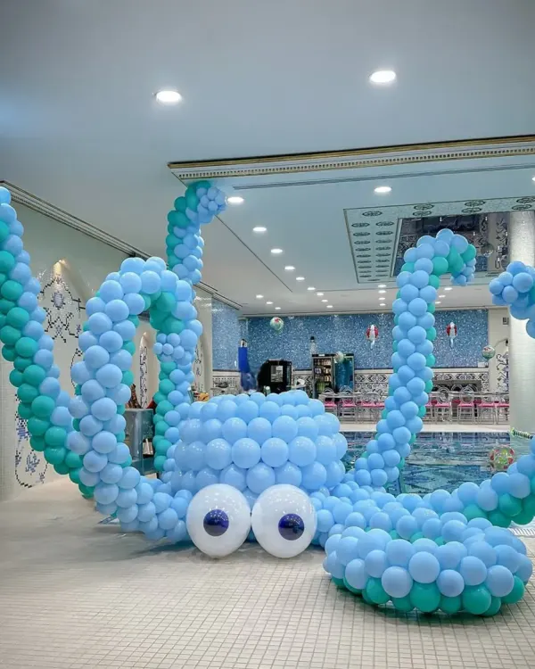 Our giant balloon octopus is always a showstopper! This incredible sculpture was the centerpiece of a poolside mermaid party, adding a huge element of fun and wonder.