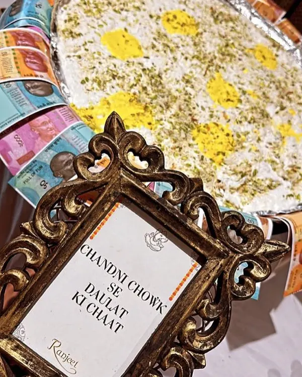 Our famous 'Chandni Chowk Se Daulat Ki Chaat,' a light and airy dessert, presented with a creative flair that delights guests and evokes the spirit of Old Delhi.