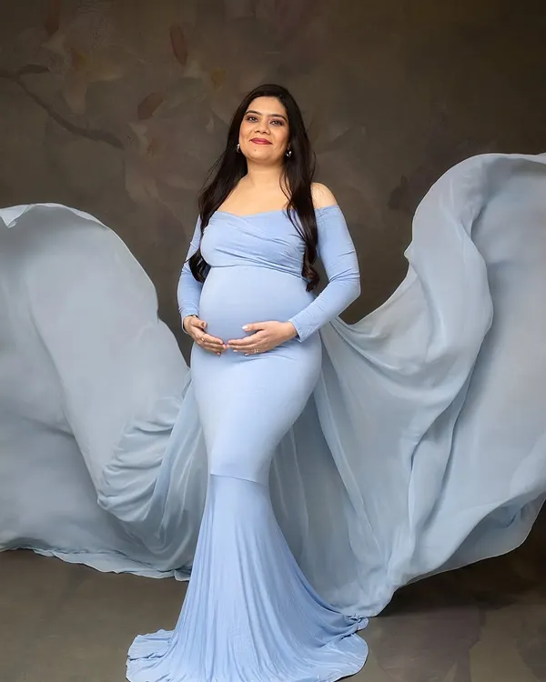 A vision in blue. The flowing fabric of this gown adds drama and movement, creating a stunning silhouette against the classic studio backdrop. This is a favorite from my client wardrobe.