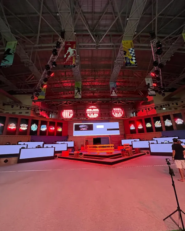 The full setup for a major e-sports tournament, with individual gaming stations arranged on the main floor. This shows our capacity to host large, multi-player gaming events.