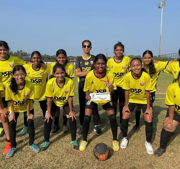 This is the look of a team that left everything on the field. Our girls squad in their yellow jerseys, posing together after a tough match at a tournament, showcasing their unity and fighting spirit.