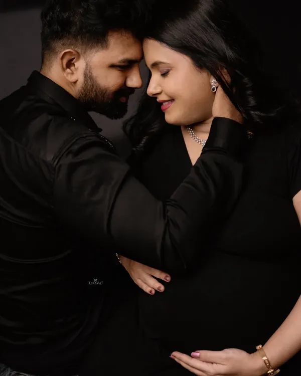 A powerful and intimate close-up of a couple. This shot focuses on the deep connection and quiet love between them as they prepare to become parents.