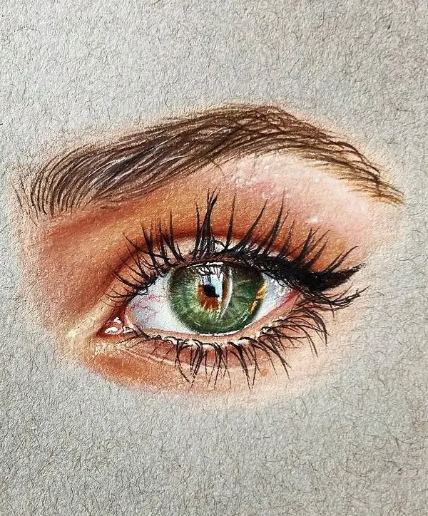 A hyper-realistic drawing of a green eye, created with Prismacolor pencils on toned paper. I focused on capturing the reflection in the pupil and the fine texture of the eyelashes.