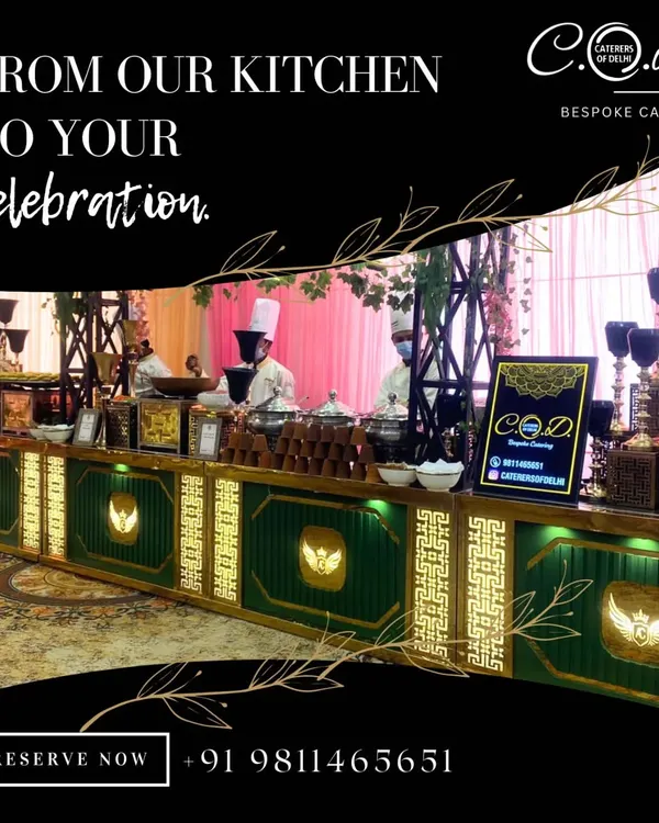 A look at one of our grand buffet setups, designed to be the stunning centerpiece of your celebration. This expansive arrangement features illuminated counters with gold and green accents, showcasing our commitment to creating a luxurious dining atmosphere.
