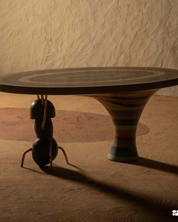 The Weavers Ant Table, where the ant is the architect. This terrazzo dining table balances the sculptural beauty of mountains with the creative force of nature, featuring harmonious colors and a unique form that make it a true statement piece.