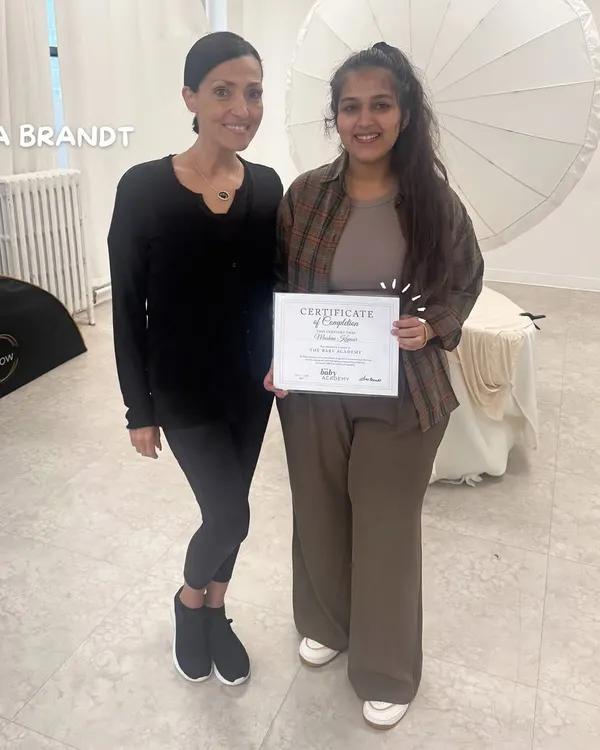 Here I am, holding my certificate of completion after training with the world-renowned newborn photographer Ana Brandt in New York. This investment in my craft ensures I bring international standards of safety and artistry to your session.