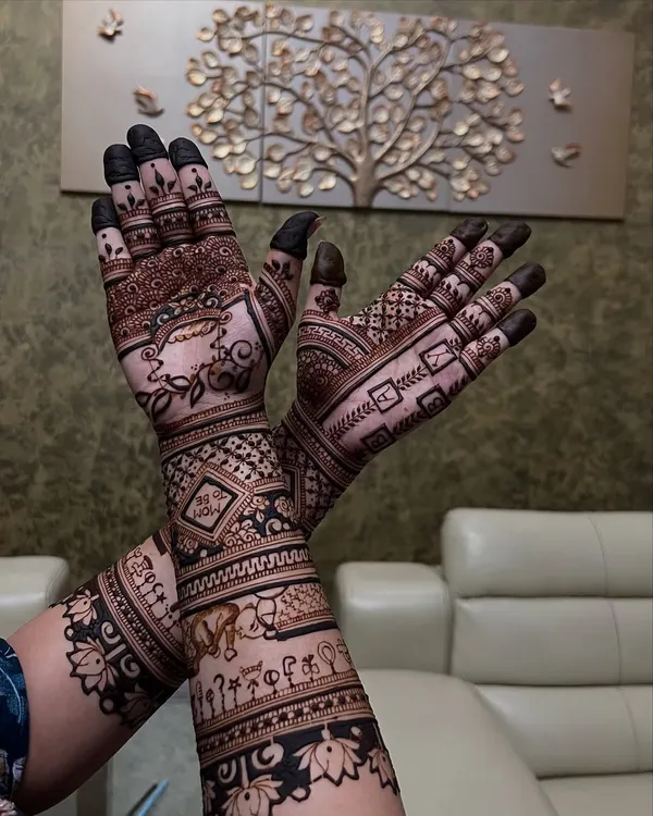 A special mehendi for a baby shower, featuring a cradle and other baby-related motifs to celebrate the mom-to-be.