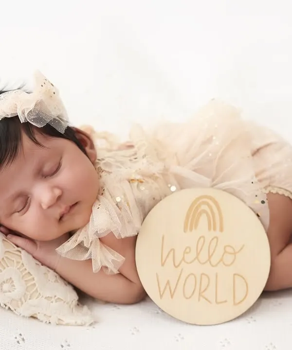 Hello, world. This is one of my favorite ways to announce your baby's arrival. The simple "hello world" plaque next to your peacefully sleeping newborn creates a beautiful and classic birth announcement photo.