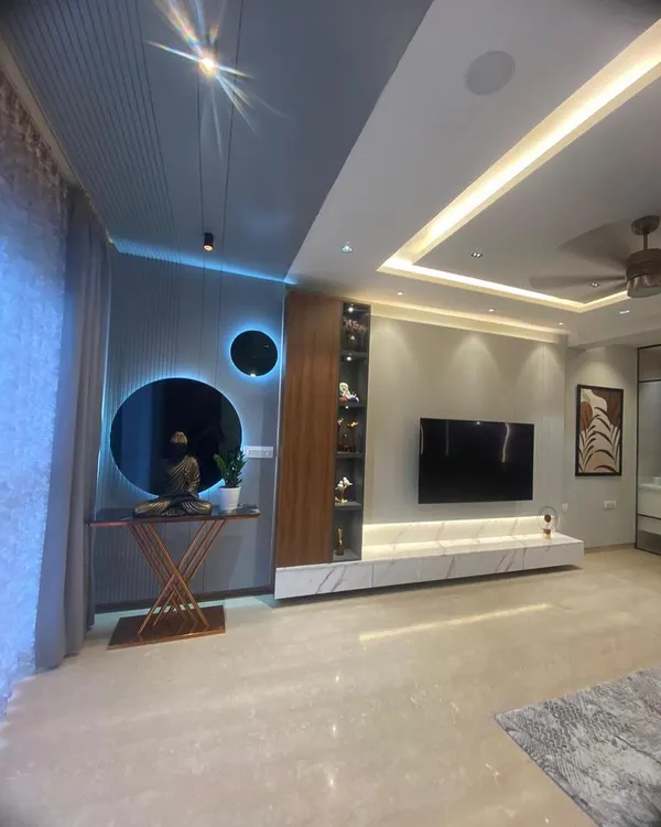 This is where modern luxury meets comfort. I designed this living room in Bangalore with custom lighting and a serene ambiance, creating a perfect space for the family to unwind.