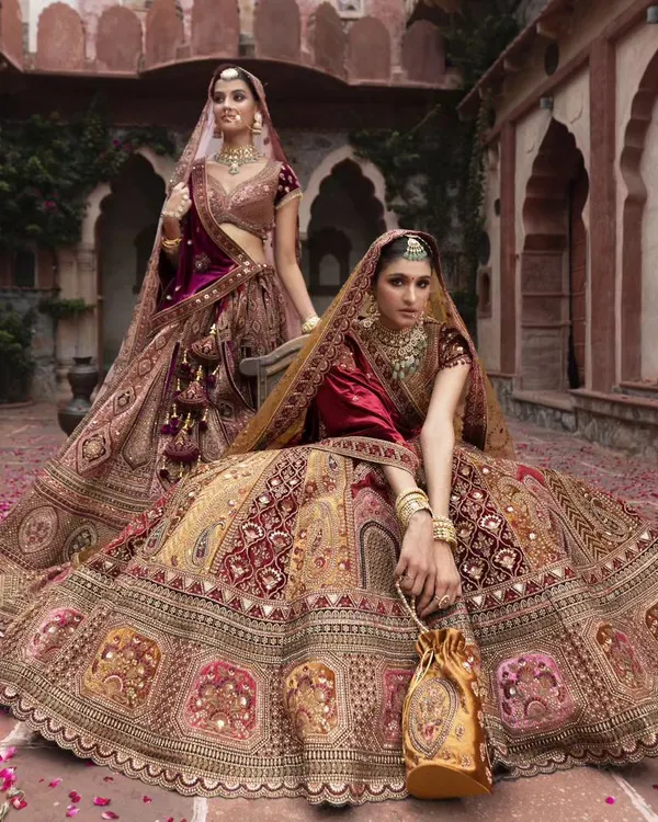 A royal-themed photoshoot. This image captures the grandeur and elegance of high-fashion bridal styling.
