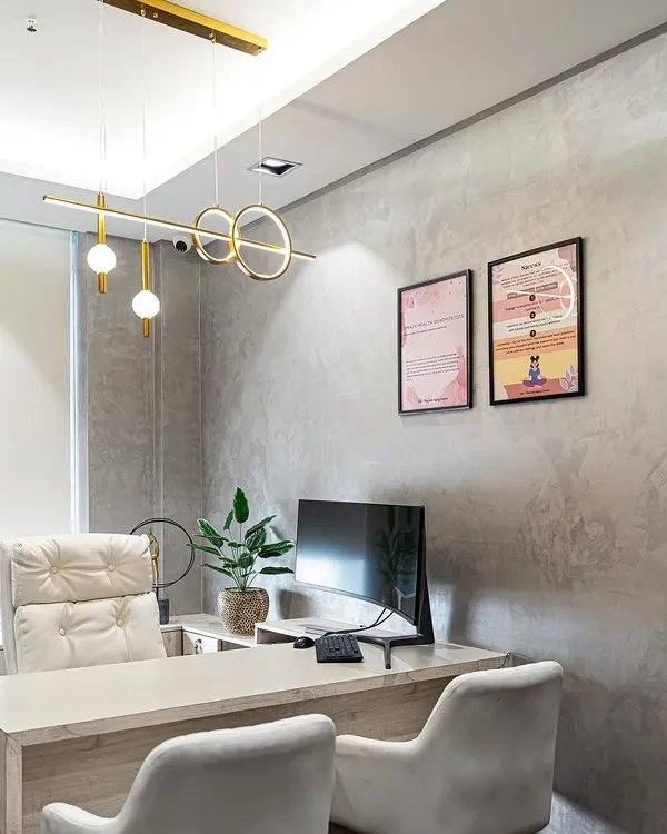 A client's office featuring our modern linear pendant. The light provides excellent functional lighting for the desk while adding a strong design element to the room.