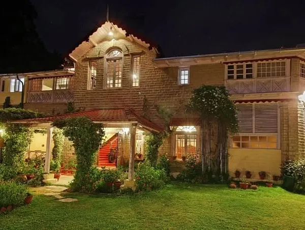 The Chevron Rosemount Hotel in Ranikhet illuminated at night. Our lighting design highlights the building's architectural features and creates a warm, welcoming ambiance after dark.
