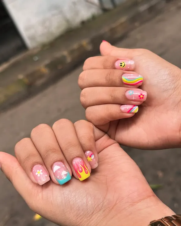 For when you want your nails to be the life of the party. This fun, mismatched set features hand-painted retro rainbows, smiley faces, clouds, and flames for a totally unique and playful look.