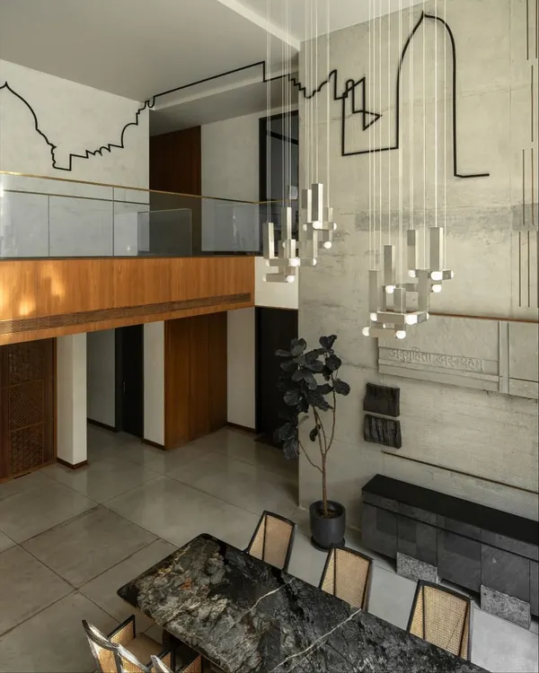 We see every space as a story waiting to be told. In this double-height residence, a single metal line flows across walls and ceilings, an architectural installation that redefines the home's volume and connects its planes, turning a structural element into a piece of narrative art.
