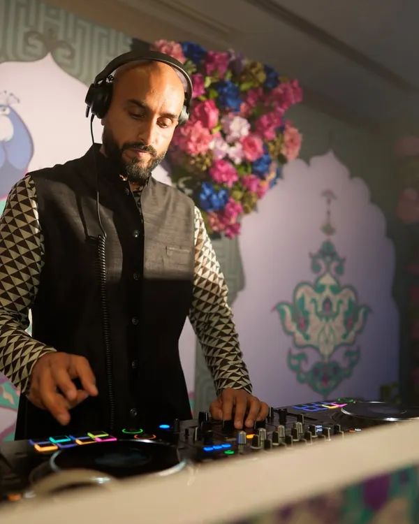 On the decks at a vibrant Sangeet party. The decor was incredible, but my focus was on the music, mixing tracks to build the energy for the night ahead.