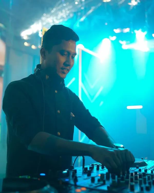 I believe the right music and lighting can transform any space. Here I am, in my element, setting the perfect mood for a high-energy wedding after party.