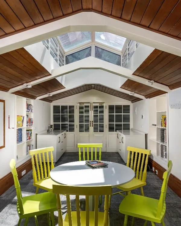 A once-disused attic from a 1920s building, reimagined as a vibrant, light-filled workspace. By introducing a central skylight, we transformed a dark, forgotten area into a functional and inspiring environment, demonstrating how sensitive retrofitting can unlock the hidden potential in heritage structures.