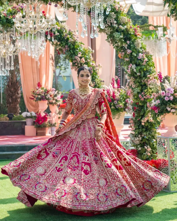 A bride's joy is radiant. I love capturing these twirling shots that show off the stunning detail of the wedding lehenga and the happiness of the moment.