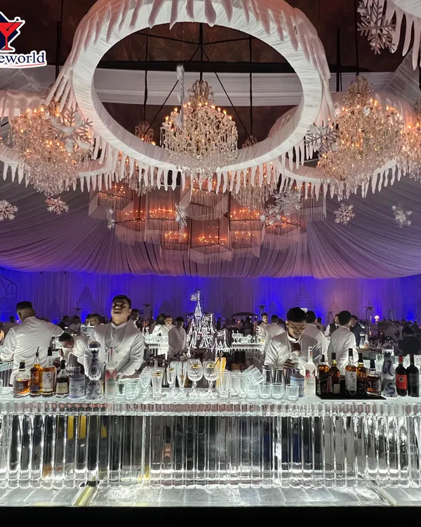 A full view of our magnificent ice bar, custom-built for a luxury wedding. The setup included crystal chandeliers and icicle-themed decor to create a truly magical winter fantasy environment for the guests.