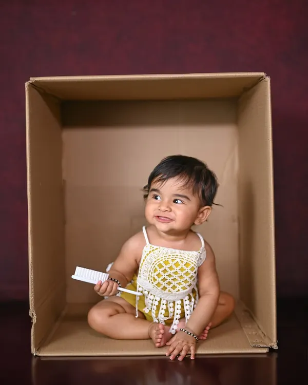 A simple box, a cute outfit, and a happy baby. Sometimes, that's all you need for a great photo!