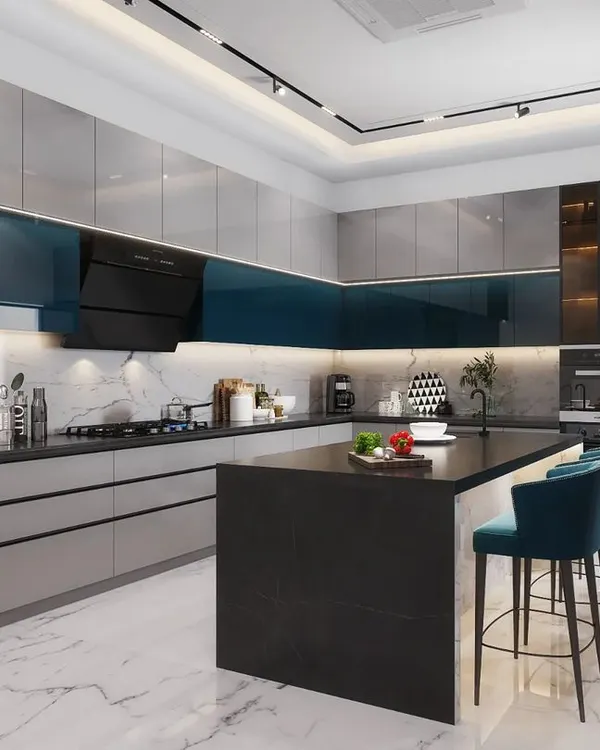 A sleek and modern kitchen designed for a residence in Rohtak. It features high-gloss grey and deep blue cabinetry, a functional island with seating, and integrated high-end appliances, making it perfect for both cooking and socializing.