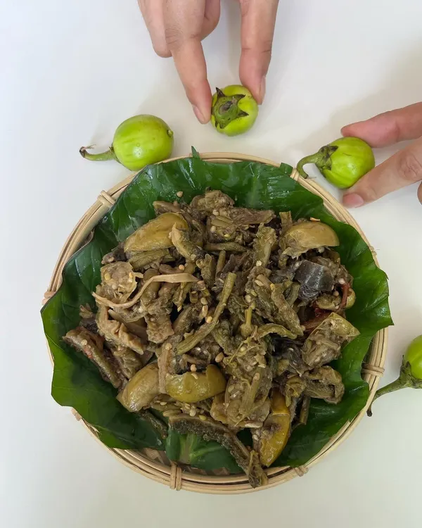 This is 'Rusep', a traditional vegetarian delicacy from the Ao tribe. It's a boiled mix of wild vegetables, including bitter eggplant and bitter gourd, creating a unique blend of bitter and tangy flavors.