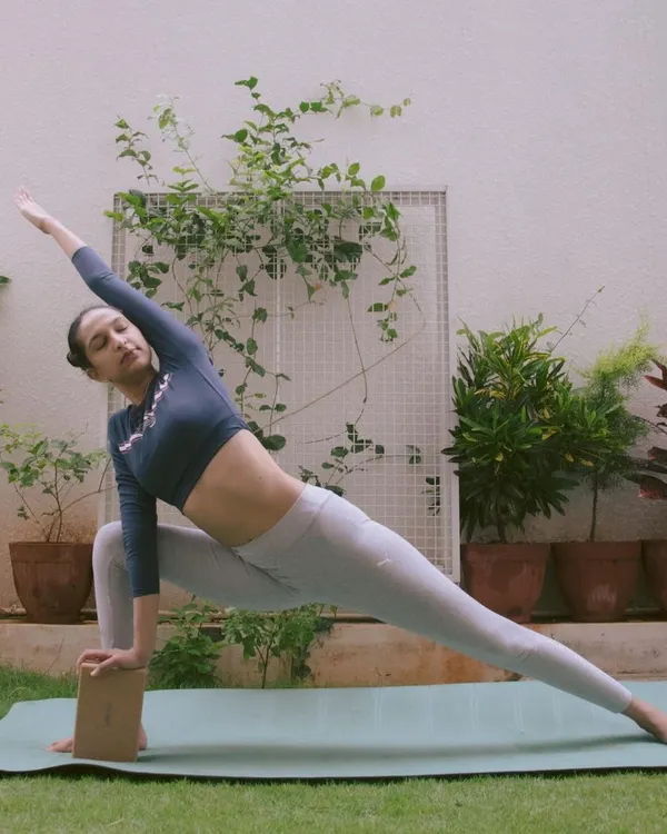 Here I am using a yoga block in Parsvakonasana (Extended Side Angle Pose). The block provides support, ensuring my alignment is correct and allowing for a deeper, safer stretch.