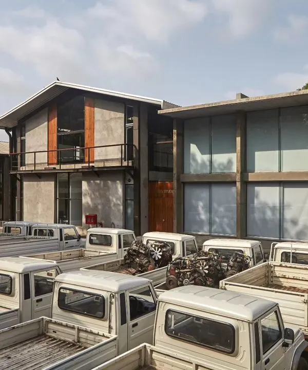 We believe in the power of adaptive reuse. For this Automobile Design Studio, we transformed five old industrial sheds into a modern workspace using a minimal palette of metal, concrete, and light, honoring the site's industrial heritage while creating a space for innovation.