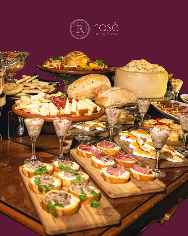 A lavish spread of artisanal breads, assorted cheeses, and cured meats. This grazing table is a feast for the eyes and the palate, offering a sophisticated and communal dining experience for your guests.