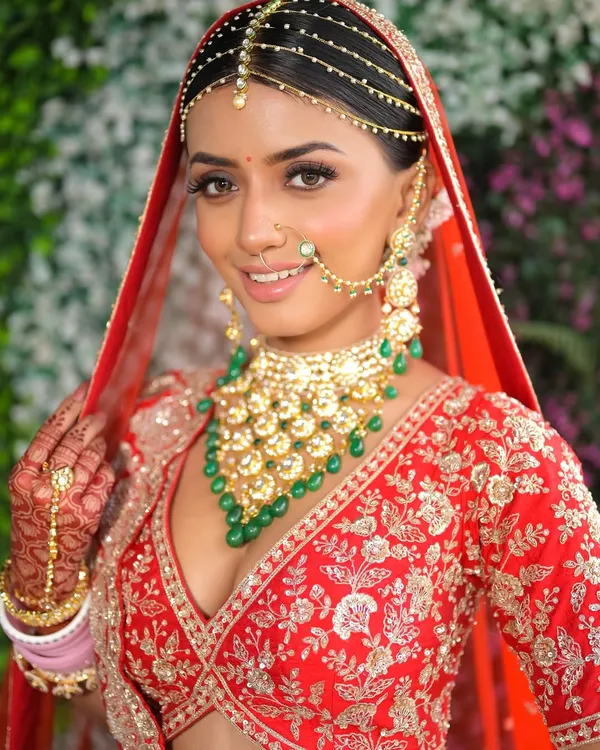 This is the moment every bride dreams of. A classic red lehenga look, elevated with luminous skin and eyes that tell a story of love and excitement. My goal is to create a timeless yet personal look that makes you feel like the most beautiful version of yourself.