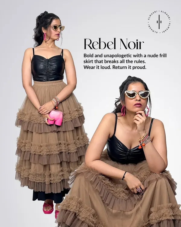 Here I've styled a bold look I call 'Rebel Noir'. I paired a black leather-look bustier with a nude tiered frill skirt. It's all about breaking the rules and having fun. The quirky elephant clutch is also available to rent.