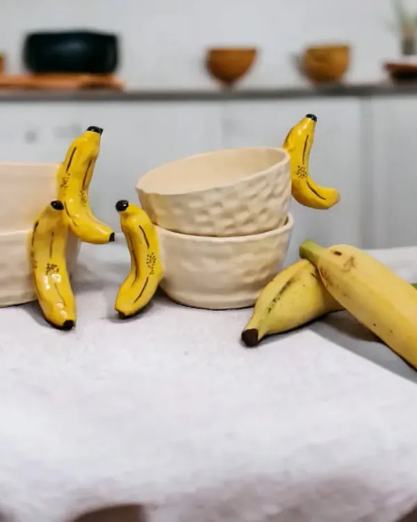 Add a touch of whimsy to your kitchen with my banana-inspired bowls. Handcrafted with love, these bowls are a playful twist on traditional ceramicware, perfect for snacks or cereal.