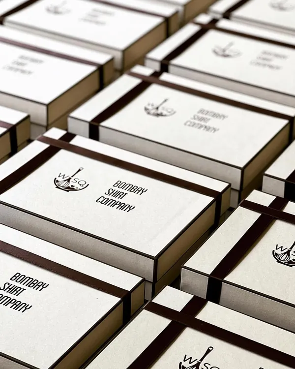 A look at our collaboration with Bombay Shirt Company. We created these custom-branded dessert boxes featuring their logo, filled with our gooey flourless chocolate bars. This is a great example of how we align our premium desserts with your brand's identity for corporate events.