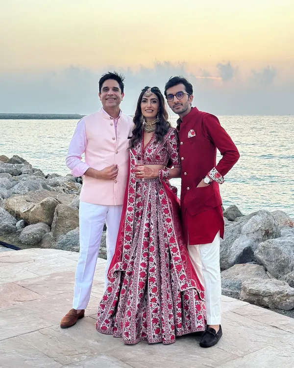 Posing with the wonderful couple against a beautiful sunset at their beach wedding. Their smiles and the stunning backdrop made this a truly memorable event.