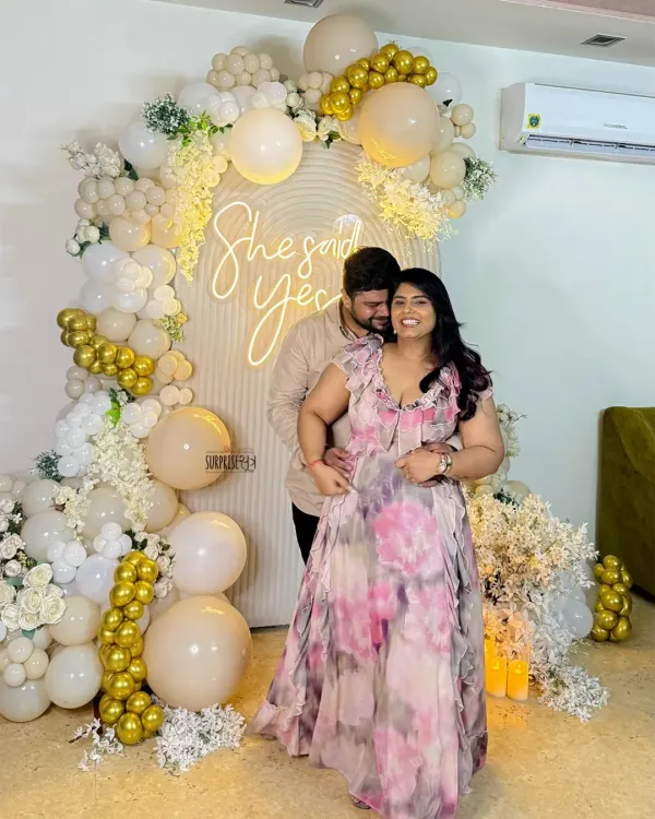 Balloons, blooms, and a whole lot of smiles because she said yes! This happy couple is glowing in front of the custom backdrop we created for their special moment. Capturing this joy is the best part of our job.