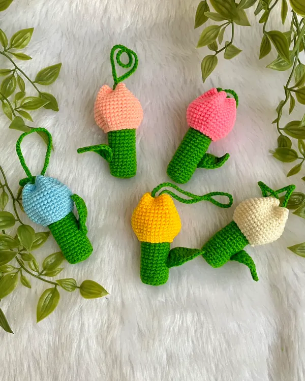 A collection of my tulip lipstick holders in various colors. These cute charms keep your lipstick handy and add a floral touch to your bag.
