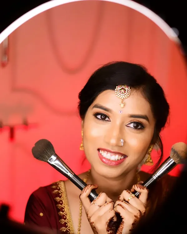 A fun and creative shot of the bride-to-be, Lavanya, for her ring ceremony. Her makeup is fresh and bright, perfect for this happy occasion.