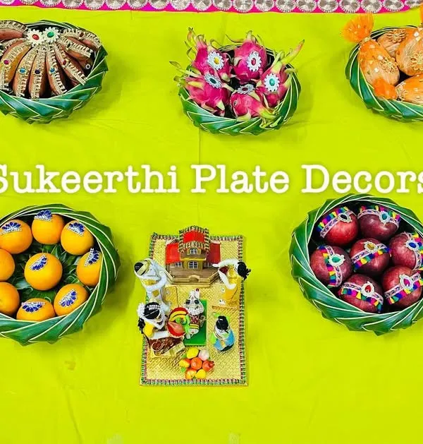 A lovely platter arrangement for a housewarming ceremony in Sirumugai. The platters are filled with auspicious items like fruits and sweets to bring good fortune to the new home.