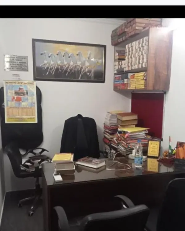 A view of my chamber, where strategy is formulated and cases are meticulously prepared. The extensive library and case files are a testament to our thorough research process for every matter we undertake.