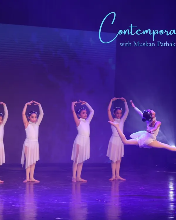 A breathtaking leap captured during our kids' contemporary performance. Our annual showcase gives young dancers the chance to experience the thrill of performing on a grand stage.
