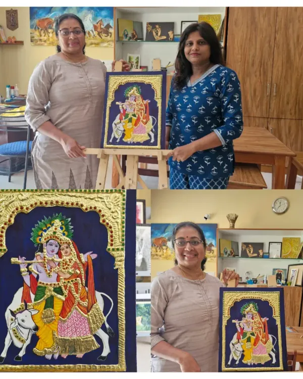 Hamsa proudly displays her completed Tanjore painting of Radha and Krishna. She has masterfully executed the intricate gold work and detailing that this art form is famous for.