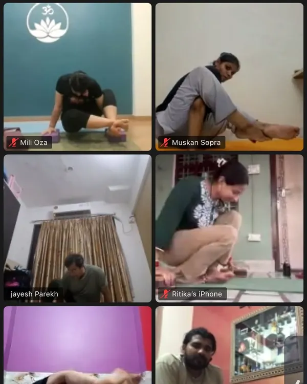 A screenshot from our online yoga class, showing students practicing various asanas from their homes. We ensure everyone receives attention, even through a screen.