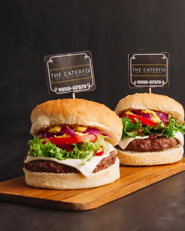 My signature burgers are a party favorite. I build them with a thick, juicy patty, crisp lettuce, onions, tomatoes, and a slice of cheese on a toasted bun. It’s a satisfying meal that always gets great reviews from guests.