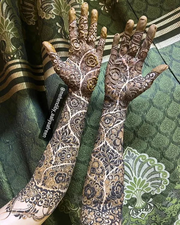 This is the kind of full-coverage bridal mehendi I absolutely love to create. We went for a super intricate, "bhari hui" floral design that extends all the way up the arms, leaving no gaps. It takes hours, but the final look is always worth it.